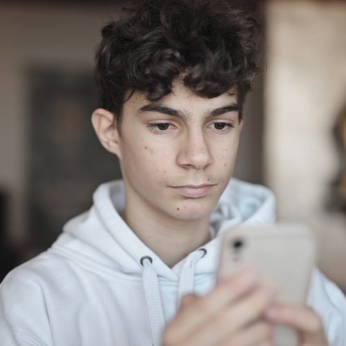 young guy uses a smartphone